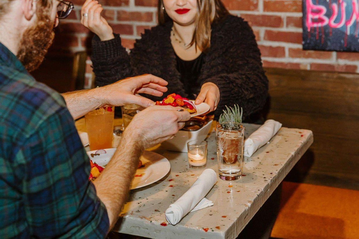 Interior atmosphere and ambiance at Dada Gastropub in downtown Sioux Falls, South Dakota, showcasing the modern gastropub design, warm lighting, and inviting dining space. Architectural and interior photography capturing the unique character and welcoming environment of this South Dakota restaurant.